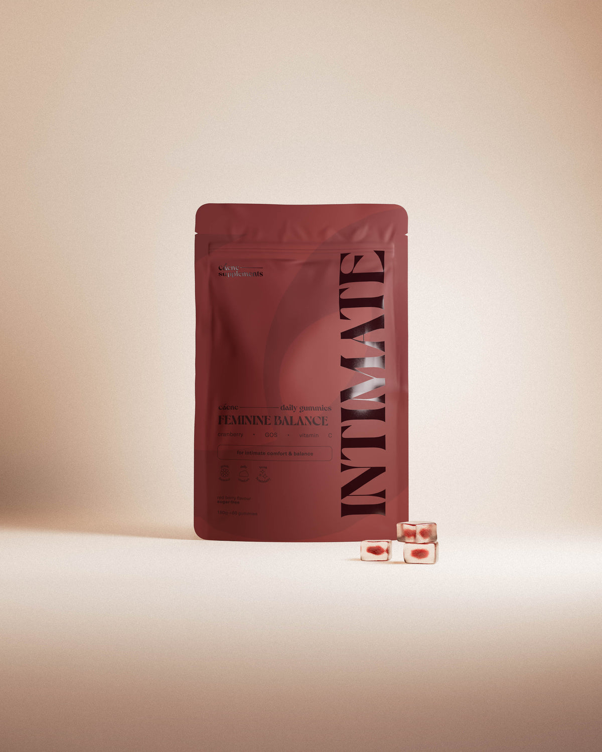 intimate gummies pouch standing upright with a few gummies beside it